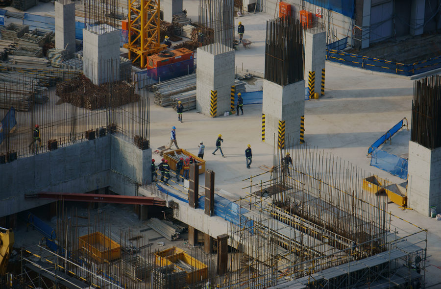 Crews working across a large concrete deck